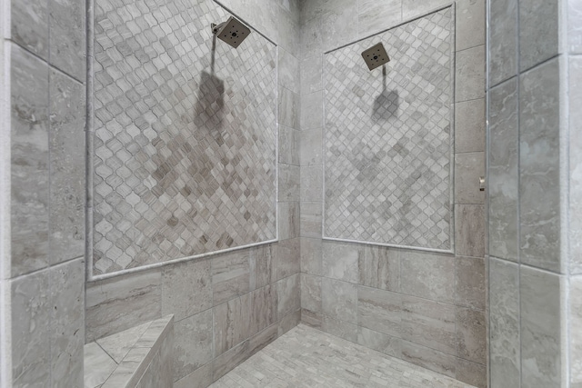 bathroom with tiled shower