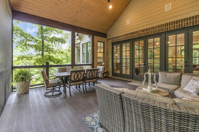 sunroom featuring wooden ceiling and lofted ceiling