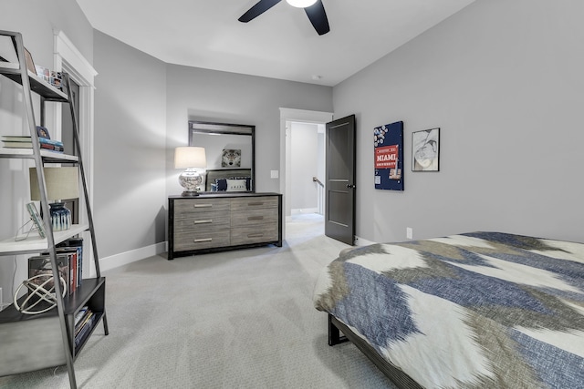 bedroom featuring ceiling fan and light carpet