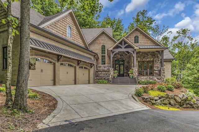 view of front of property featuring french doors and a garage