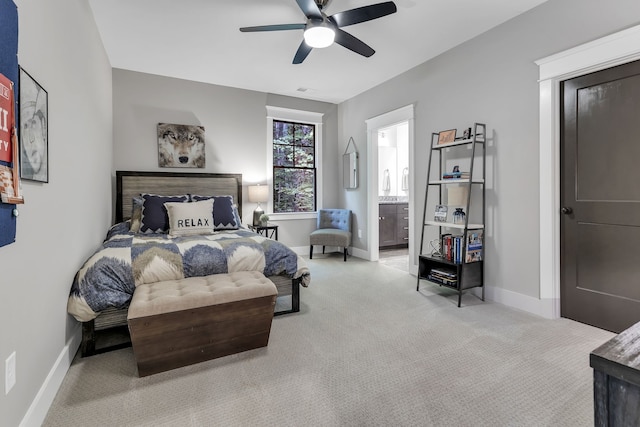 carpeted bedroom featuring connected bathroom and ceiling fan