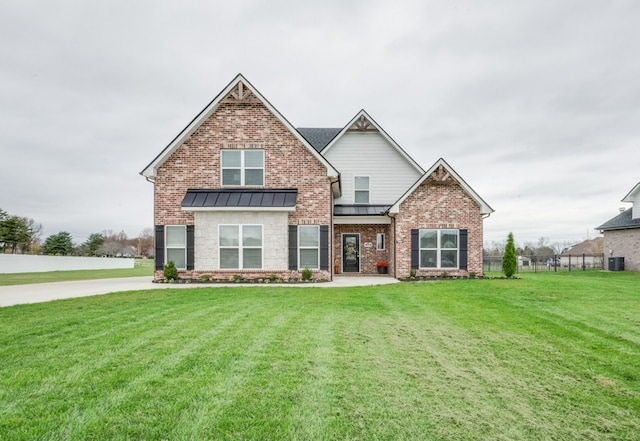 craftsman inspired home featuring central AC and a front lawn