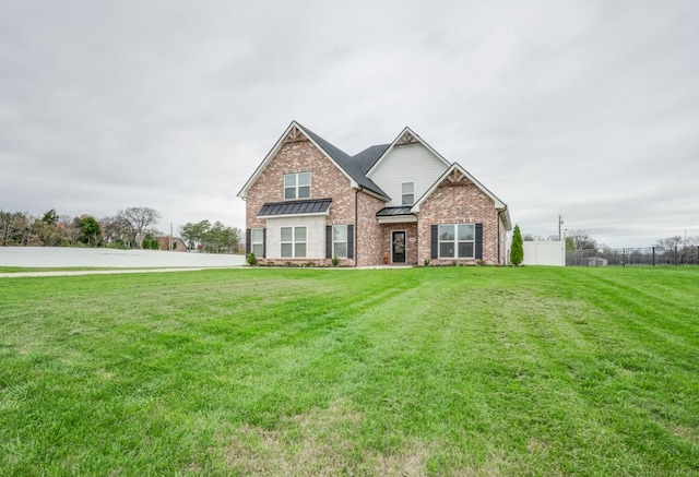 craftsman-style home featuring a front yard