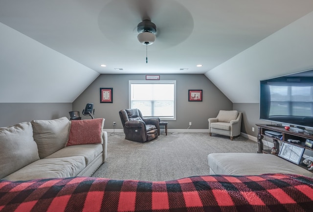 living room featuring ceiling fan, light colored carpet, and vaulted ceiling