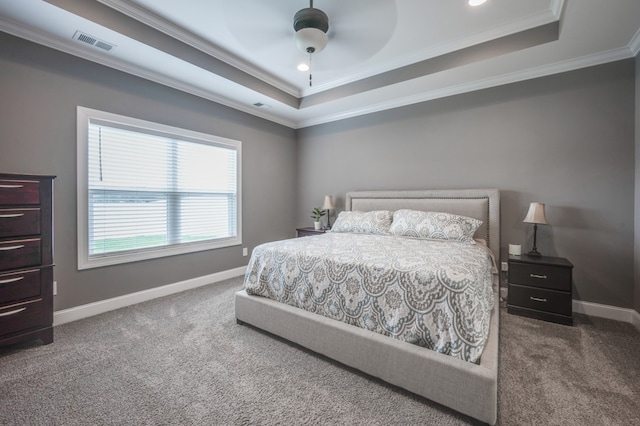 bedroom with ceiling fan, crown molding, and carpet floors