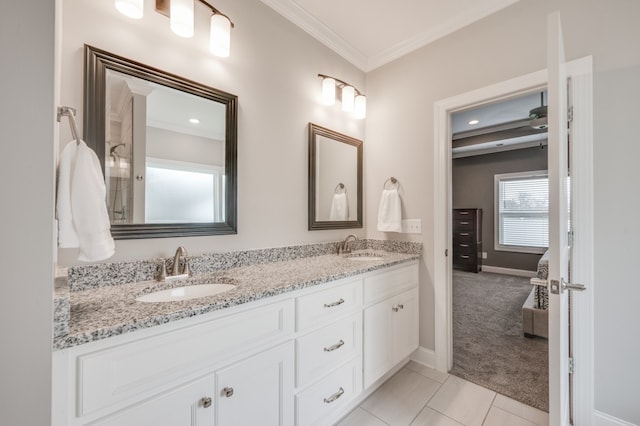 bathroom featuring tile patterned floors, vanity, and ornamental molding