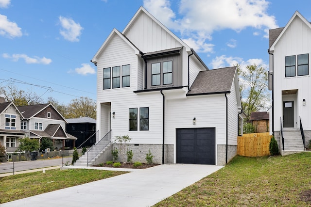 view of front of home with a garage and a front lawn