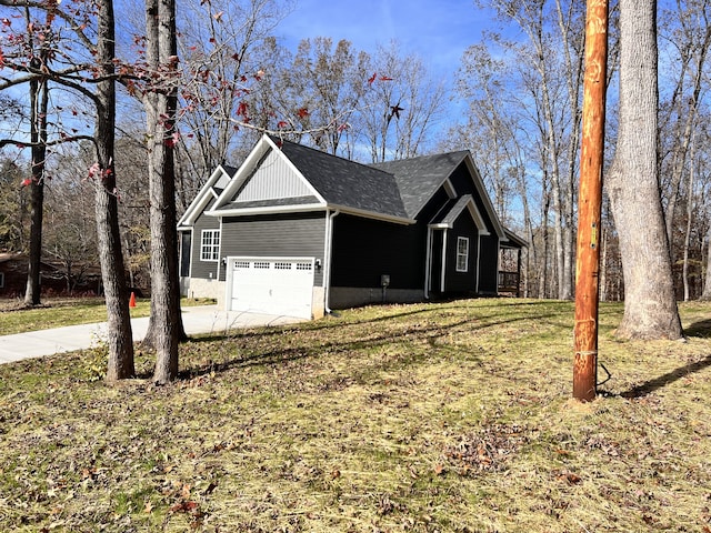 view of side of home with a yard