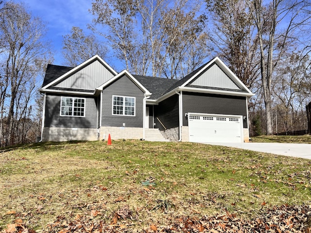 view of front of property featuring a garage and a front lawn