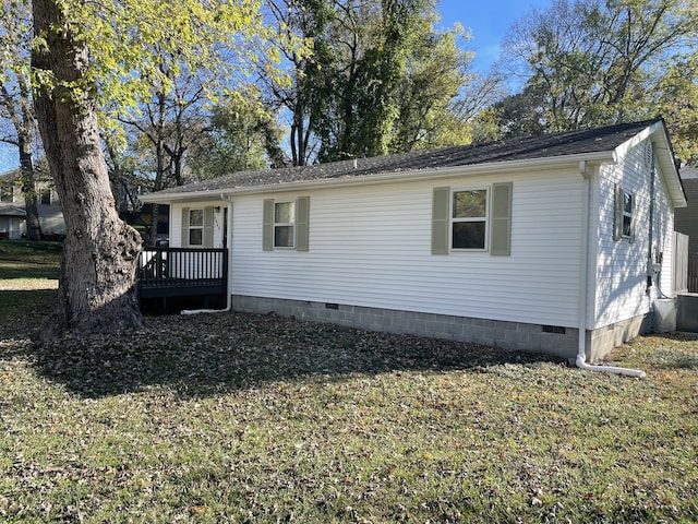 view of property exterior with a yard and central air condition unit