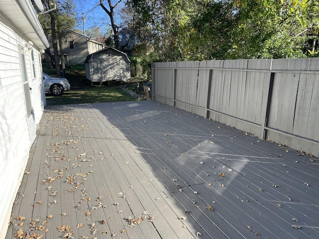 wooden deck featuring a shed