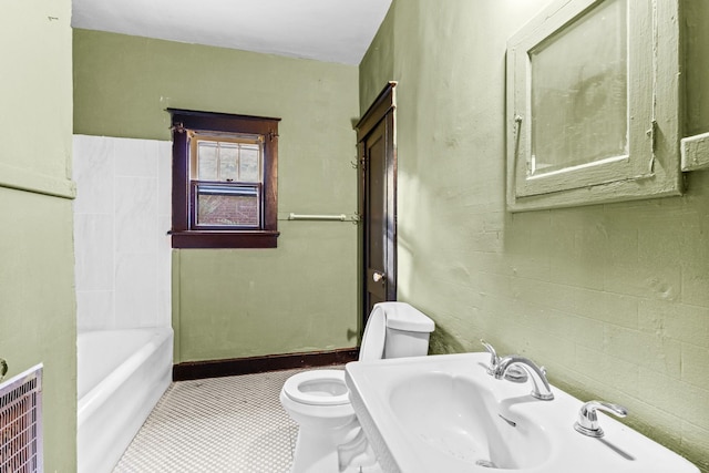 bathroom with tile patterned floors, a bathing tub, sink, and toilet