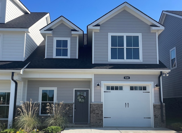 craftsman inspired home with a garage