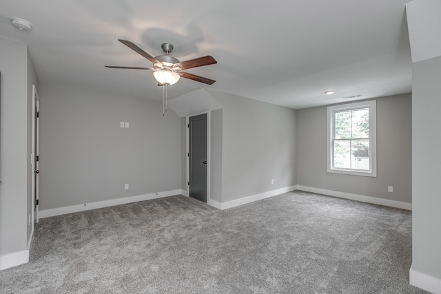 empty room with carpet floors and ceiling fan