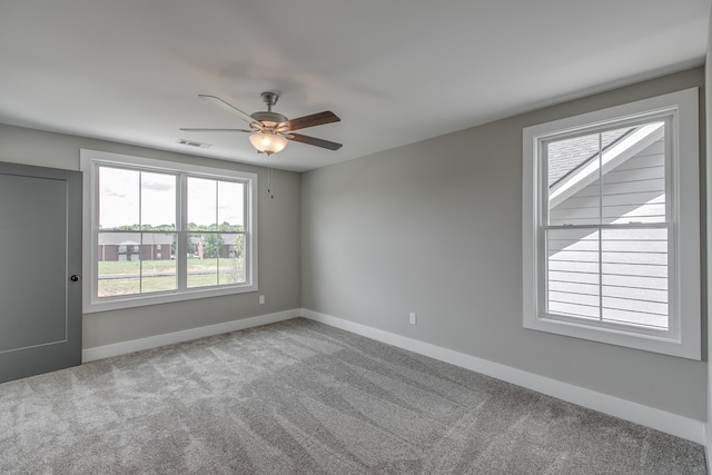 unfurnished room featuring carpet and ceiling fan