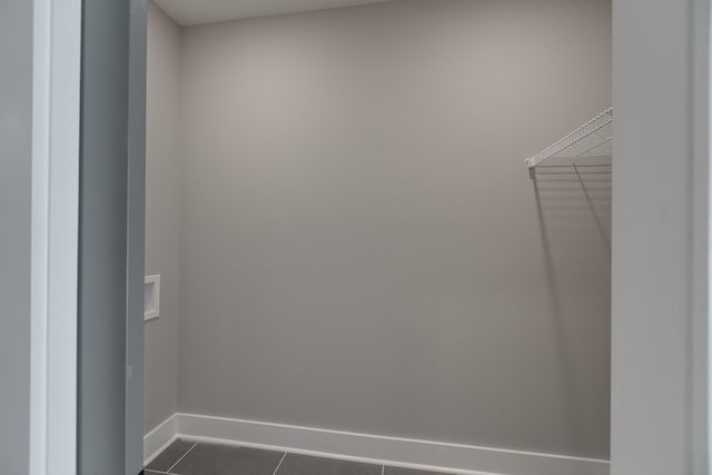 interior space with dark tile patterned flooring