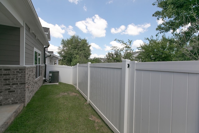 view of yard with central AC unit