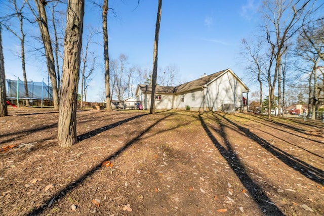 view of property exterior featuring a trampoline