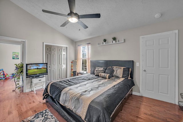 bedroom featuring wood-type flooring, a textured ceiling, and ceiling fan