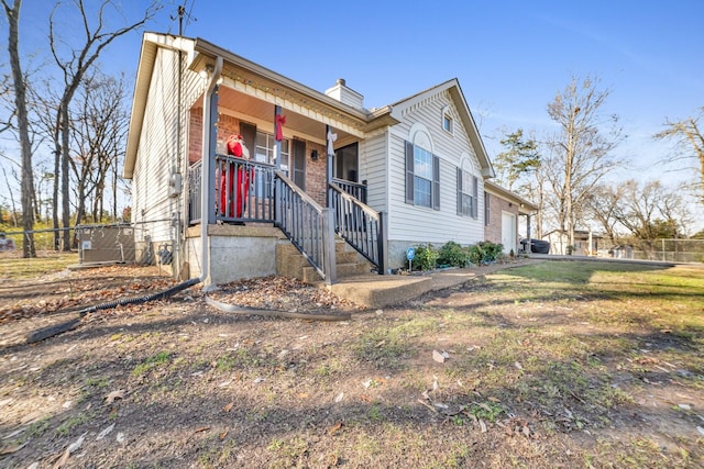view of front of home featuring covered porch and a garage