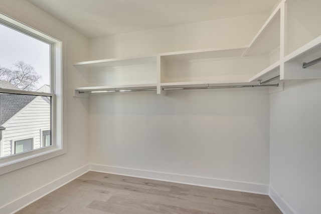 walk in closet featuring light wood-type flooring