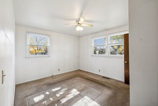 carpeted empty room with ceiling fan