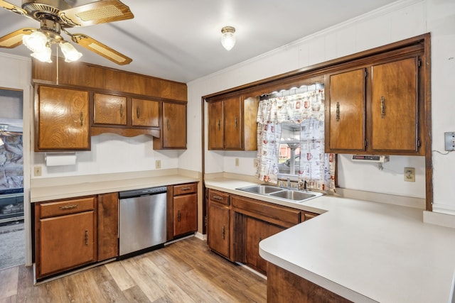 kitchen featuring stainless steel dishwasher, ceiling fan, crown molding, sink, and light hardwood / wood-style floors