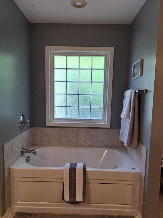 bathroom featuring a tub