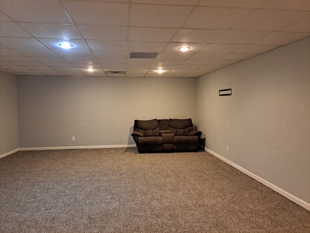 unfurnished room featuring carpet floors and a paneled ceiling