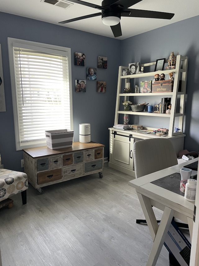 bedroom featuring light hardwood / wood-style floors and ceiling fan