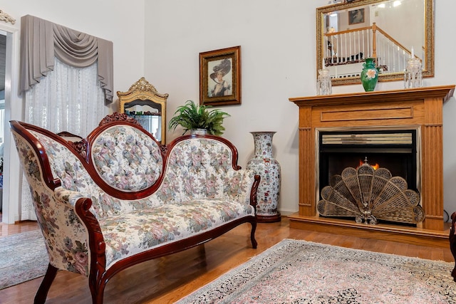 sitting room with wood-type flooring