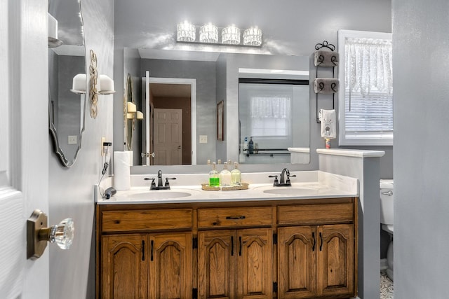 bathroom with vanity and toilet