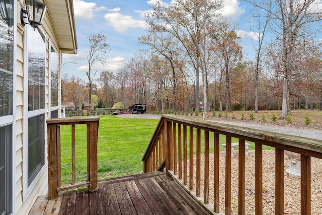 wooden terrace with a yard