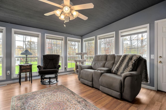 living room with light hardwood / wood-style flooring, plenty of natural light, and ceiling fan