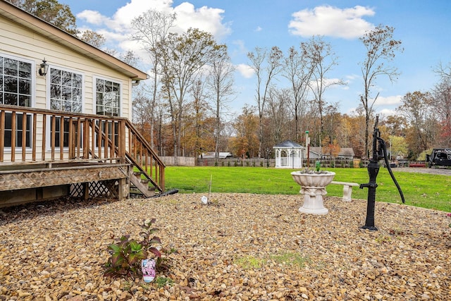 view of yard featuring an outdoor structure and a deck