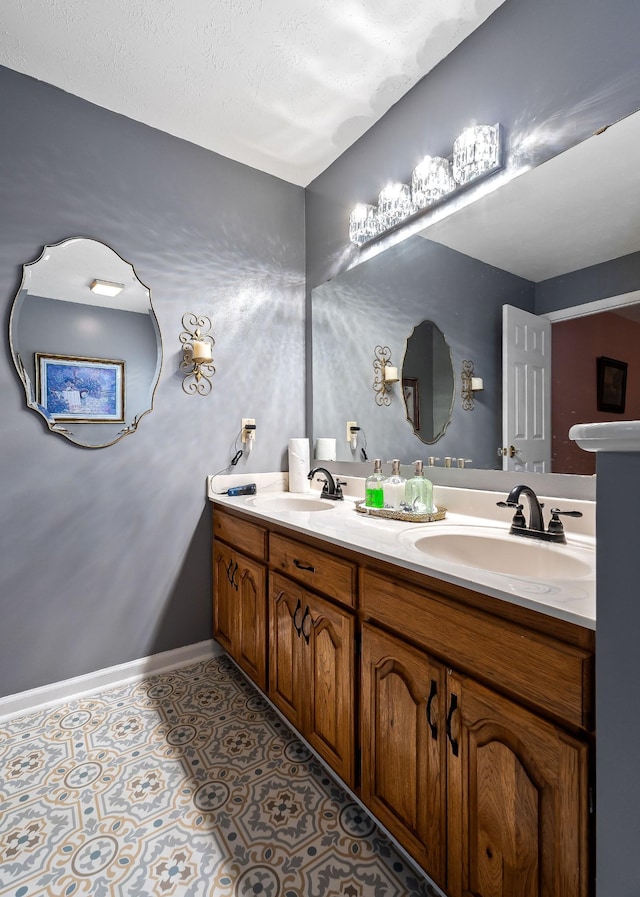 bathroom featuring vanity and a textured ceiling