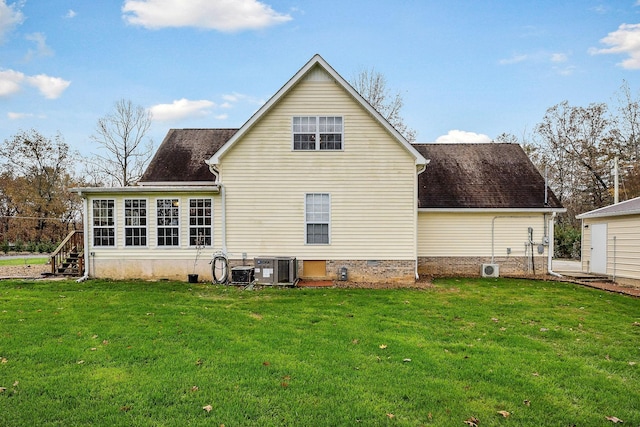 back of property with a lawn and cooling unit