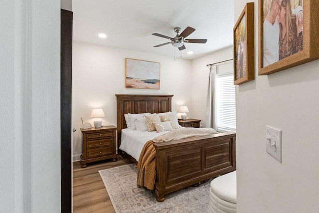 bedroom featuring ceiling fan and light hardwood / wood-style flooring