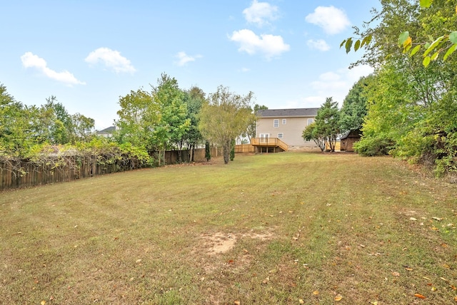 view of yard with a wooden deck