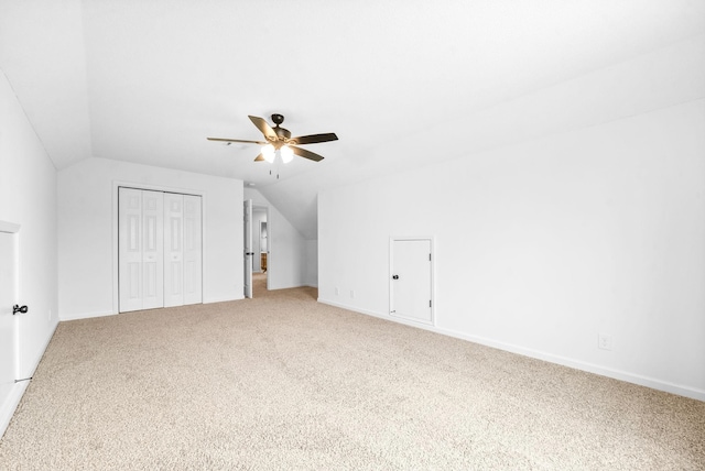 additional living space with carpet, ceiling fan, and lofted ceiling