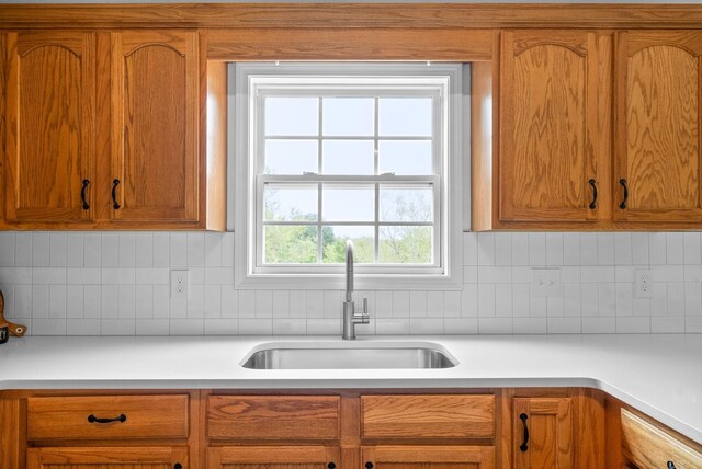 kitchen with sink and tasteful backsplash