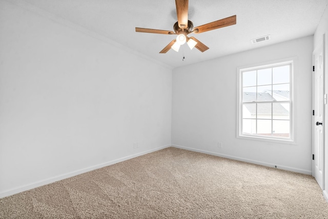 empty room with carpet flooring and ceiling fan