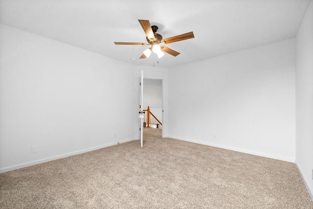 empty room featuring carpet and ceiling fan