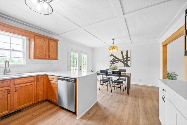 kitchen featuring a healthy amount of sunlight, dishwasher, pendant lighting, and sink