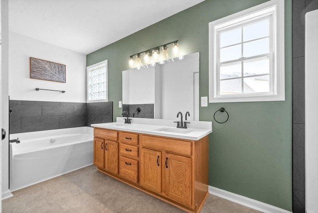 bathroom with a tub to relax in and vanity