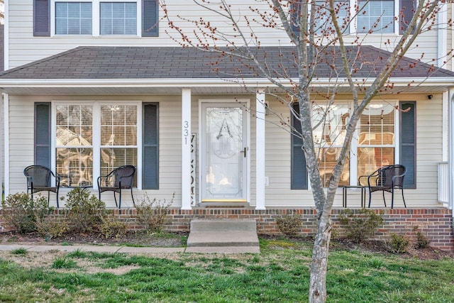 entrance to property featuring a porch