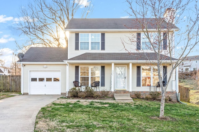 front of property with a porch, a garage, and a front lawn