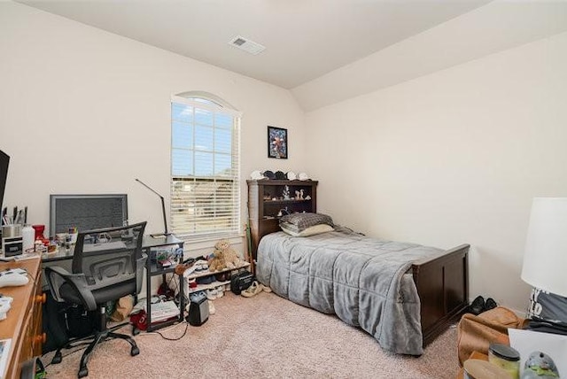 carpeted bedroom featuring vaulted ceiling