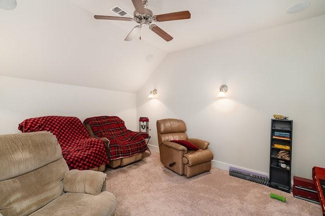 living room featuring ceiling fan, light colored carpet, and vaulted ceiling