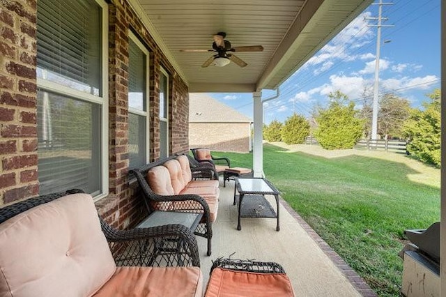 view of patio / terrace featuring ceiling fan and an outdoor living space